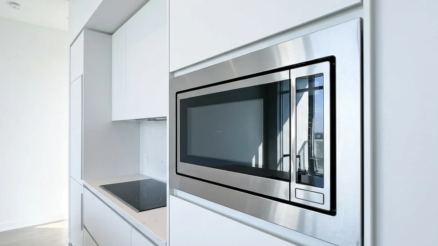 Microwave Repair - Appliance Repair GTA Built-in stainless microwave in clean white cabinetry